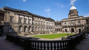 a large building with a clock tower on top of it at Edinburgh Centre - George Square Residence in Edinburgh