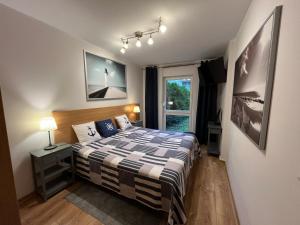 Posteľ alebo postele v izbe v ubytovaní Apartament Marcin
