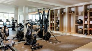 a gym with several treadmills and exercise bikes at Hotel Indigo Bridgetown Barbados by IHG in Bridgetown