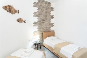 A bed or beds in a room at Eden apartments Paliouri- Concordia apartment