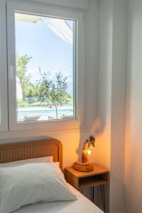 A bed or beds in a room at Eden apartments Paliouri- Concordia apartment