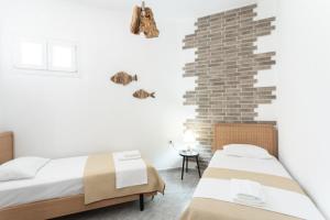 A bed or beds in a room at Eden apartments Paliouri- Concordia apartment