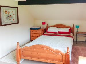 En eller flere senge i et værelse på Greenwood Cottage + 6 billeder