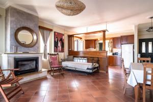 a living room with a bed and a fireplace at Villa sea view 1 in Athanion +7 photos