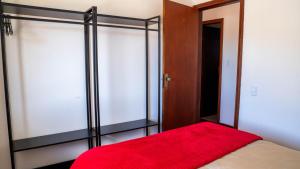 Łóżko lub łóżka w pokoju w obiekcie Casa com lareira, Wi-Fi e varanda com vista