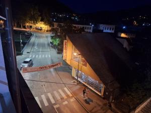 an overhead view of a city street at night at Apartman Centar Visegrad in Višegrad