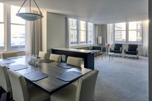 a dining room with a table and chairs at Loews Philadelphia Hotel in Philadelphia