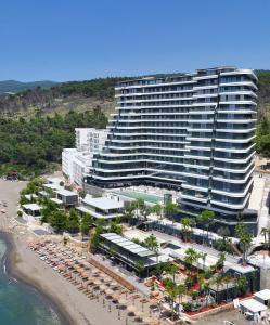 an aerial view of a large building on a beach at Ilyonis Hotel & Spa in Shëngjin