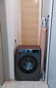 a washer and dryer in a small room at Twins home in Ierápetra