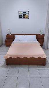 a bedroom with a large bed with at Twins home in Ierápetra
