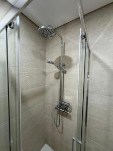 a shower with a glass door in a bathroom at Casa Gidelos in Geres +53 photos