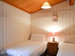 Postel nebo postele na pokoji v ubytování Cedar Lodge