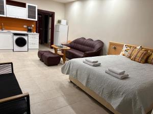 a bedroom with a bed and a living room at Miramar Palace 612S in Sunny Beach +4 photos