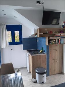 a kitchen with a sink and a counter top at Lendas Paradise studio 2 in Lentas