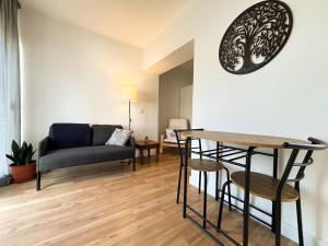 a living room with a couch and a table at Casa Miká in Parede +21 photos