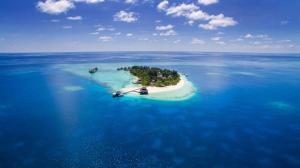 an island in the middle of the ocean at Adaaran Club Rannalhi - All Inclusive - 45 Minutes away from Male by Speedboat in South Male Atoll
