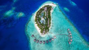 an island in the shape of a ship in the ocean at Adaaran Club Rannalhi - All Inclusive - 45 Minutes away from Male by Speedboat in South Male Atoll