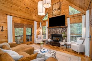 a living room with a fireplace and a tv at Blue Ridge Cabin Near Downtown Fire Pit and Hot Tub in Blue Ridge
