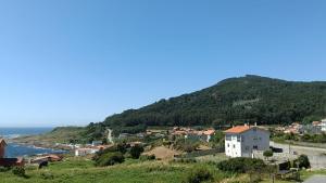 a town on a hill next to the ocean at Villa Ruperta in A Guarda