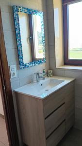a bathroom with a sink and a mirror at Villa Ruperta in A Guarda +12 photos