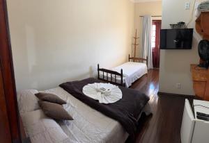Hotel Chão Mineiro客房内的一张或多张床位