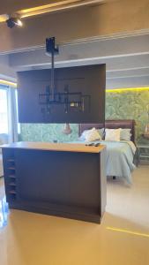 a bedroom with a bed with a large wall at Hospedaje,Cartagena,Clasicos,Turismocolombia-fit in Cartagena de Indias