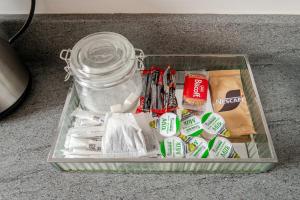 a glass container with a jar filled with different items at Spacious 2Bed Central Liverpool Nightlife & Events, sleeps up to 10 in Liverpool