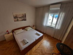Ένα ή περισσότερα κρεβάτια σε δωμάτιο στο Apartments Zeljko