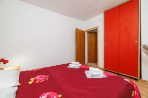 Postel nebo postele na pokoji v ubytování Apartments Tasa