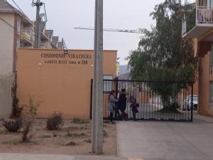 a group of people standing in front of a gate at Depto 202 viracocha in Ovalle