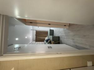 a large white room with a couch in a room at Blue Bay Beach Apartment - Laura in Sesimbra