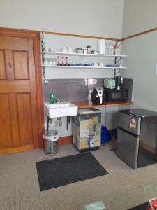 a small kitchen with a sink and a counter at Great place to stay in Gisborne +7 photos