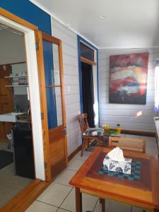 a room with a table and a kitchen with a table sidx sidx at Great place to stay in Gisborne +7 photos