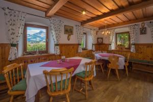 a dining room with a table and chairs at Pension Thainerhof in Reith bei Kitzbühel