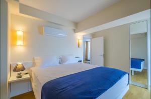 Postel nebo postele na pokoji v ubytování King Suite Panorama Central Hotel