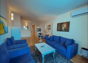 Posezení v ubytování King Suite Panorama Central Hotel