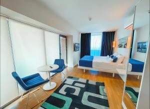 Posezení v ubytování King Suite Panorama Central Hotel