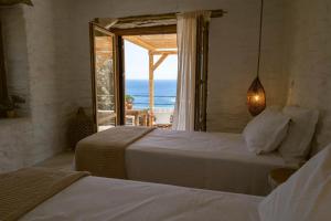 Ένα ή περισσότερα κρεβάτια σε δωμάτιο στο Kea Retreat