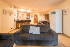 a living room with a couch and a kitchen at Bella Sirena 2BR 2BA 1st FL Spacious Patio B104 in La Choya
