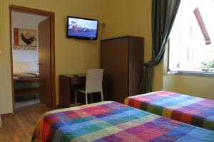 Postel nebo postele na pokoji v ubytování Hotel Domodossola