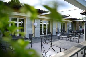 a patio with tables and chairs on a house at Agriturismo al Colle in Bertinoro