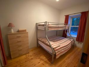 Postel nebo postele na pokoji v ubytování Carrickamore Cottage