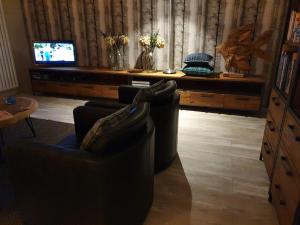Televisyen dan/atau pusat hiburan di Ferry Cottage