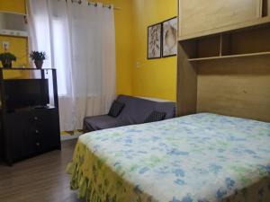 Ένα ή περισσότερα κρεβάτια σε δωμάτιο στο Apartamento temporada encantador, frente a praia