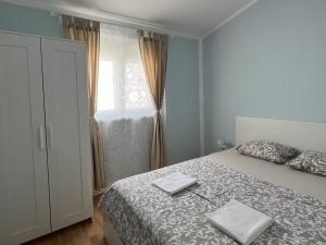 a bedroom with a bed with two towels on it at Apartments with parking space Starigrad, Paklenica - 11683 in Starigrad