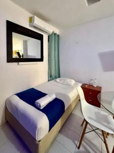 Ένα ή περισσότερα κρεβάτια σε δωμάτιο στο Loft para 3 personas con alberca en Campestre