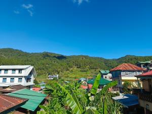 a view of a village with mountains in the background at Joysean Transient House in Sagada