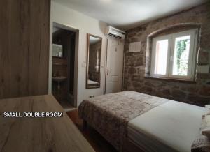 Postel nebo postele na pokoji v ubytování Guesthouse Mirula