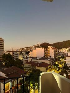 a view of a city from a balcony of a building at Casa Olas in Puerto Vallarta