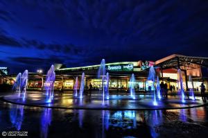 a group of water fountains in front of a building at Aeon Towers Luxury Suites in Davao City